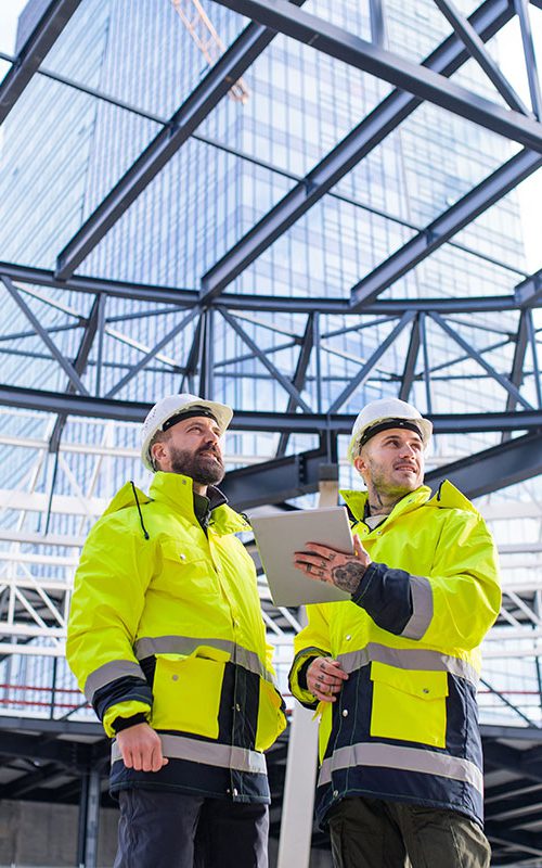 men-engineers-standing-outdoors-on-construction-si-small.jpg